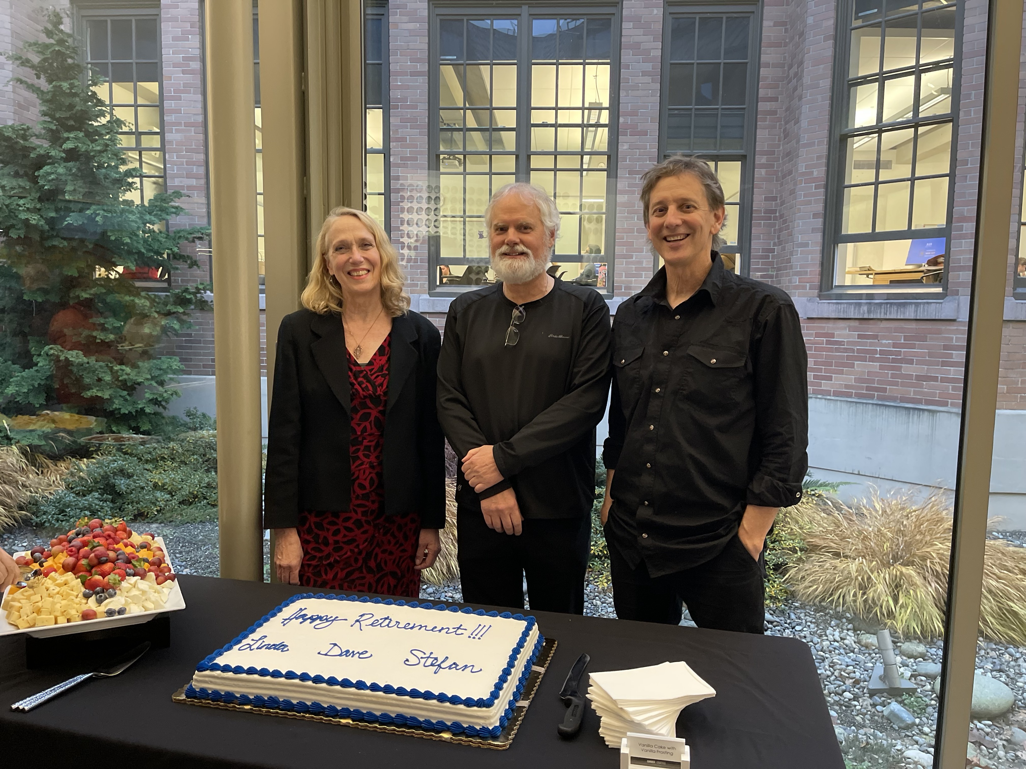 Linda Luttrell, Dave Knutson, and Stefan Freelan at their group retirement send-off in December.